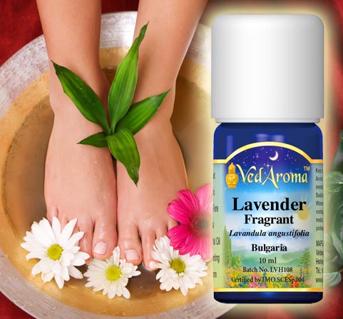 A bottle of VedAroma Lavender, Fragrant essential oil and a photo of a woman's feet in a foot bath.
